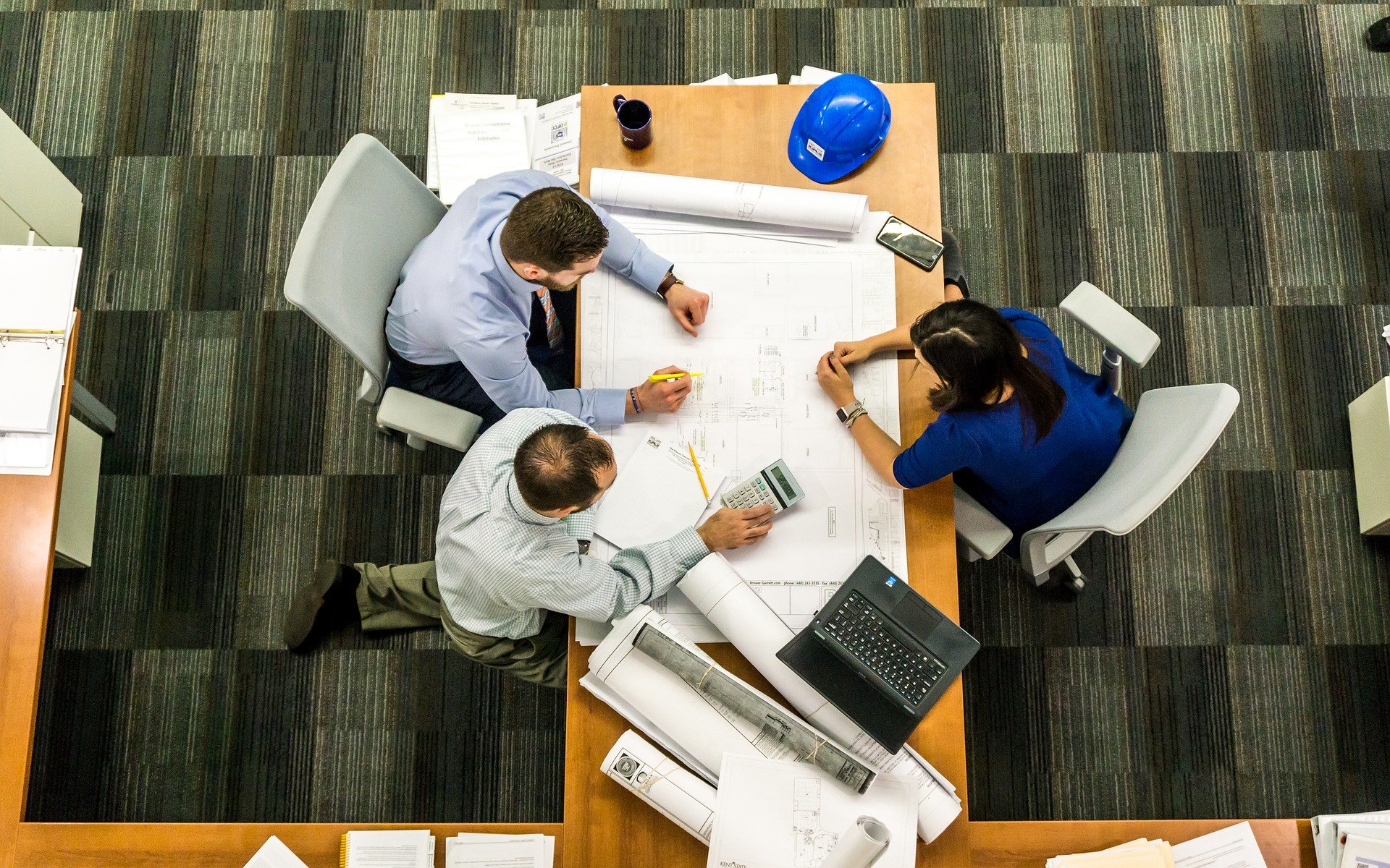 Commercial Glass Contractor meeting with office workers to discuss interior design