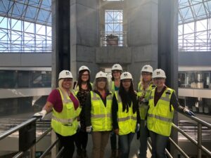 An image of some of the women in construction at Kensington Glass Arts